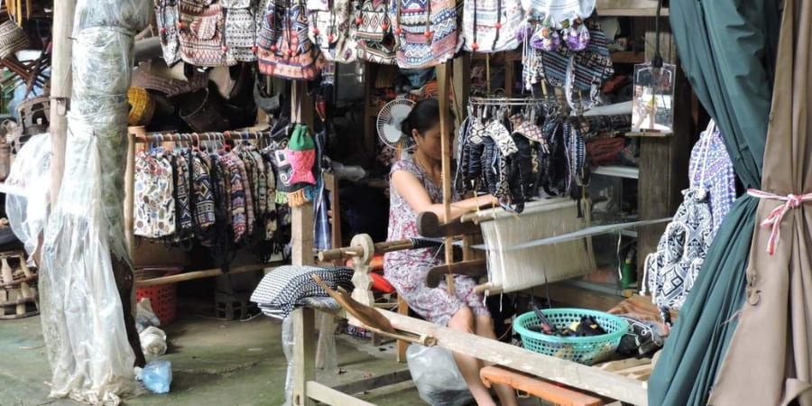 People work as weavers in Pom Coong village